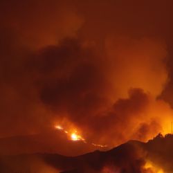 Photo of tge Wildfire across Woolsey california in 2019. hills silouetted against the fire and smoke