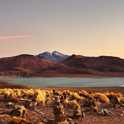 at sunset, the volcano Uturuncu, which means "jaguar" in the Quechua language, stands at height of 6,008 metres (19,711 feet) in southwestern Bolivia.